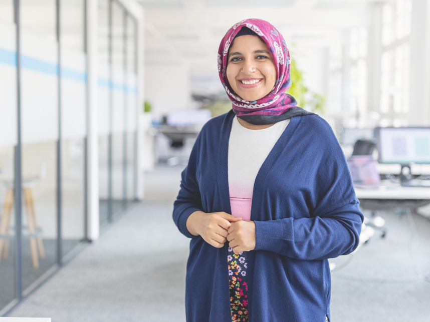 SEE -FullBleed-istock1919289294-858x643px-June24 Portrait of happy mid adult Muslim woman standing at startup office