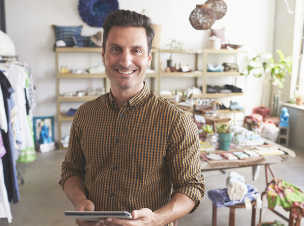 SEEPathways-BodyImageModule-iStock-638778354-618x460px Middle eastern man smiling at camera in retail store