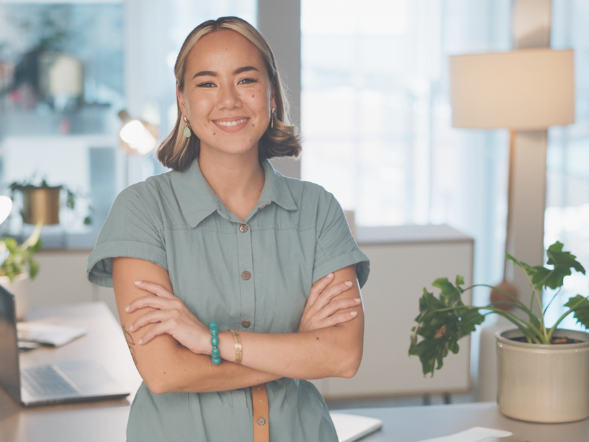 Services-Youth-FullBleedModule-818x643px-iStock-1682933861 - June 24 Portrait of a young successful Asian female programmer inside office, in glasses smiling and looking at the camera.