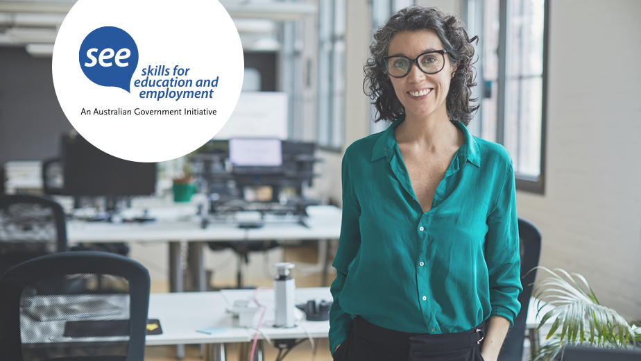 SEE-ProgramHeaderBanner-iStock1315131285-924x520px A businesswoman standing in modern workplace smiling.