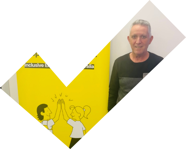 Vince standing in front of a MTC FutureReady banner while smiling. 